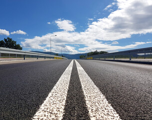 Asphalt road heading straight ahead. Double solid line on the roadway