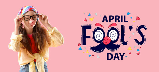 Little girl in funny disguise on pink background. Banner for April Fools' Day
