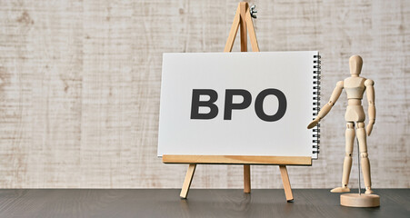 There is notebook with the word BPO. It is an abbreviation for Business Process Outsourcing as...