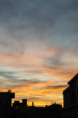 Golden, orange and blue clouds at sunset