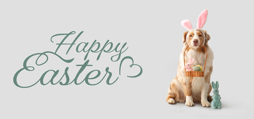 Banner with Australian Shepherd dog with Easter basket of eggs and toy rabbit on light background