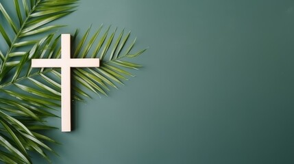 Christian cross and palm leaf on a neutral background with copy space - obrazy, fototapety, plakaty