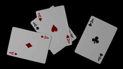 Poker, four aces in flying, playing cards isolated on black, clipping path