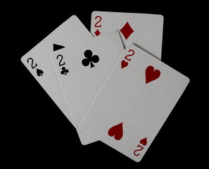 Four deuces, playing cards for poker and gambling, isolated on black, clipping