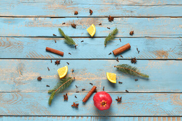 Frame made of ingredients for preparing tasty mulled wine on blue wooden background
