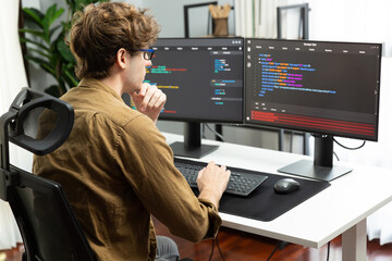 Working IT developer with stressful overworked in creating online software development coding on pc...