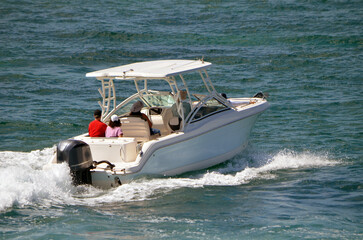 Motorboat with covered center console cruising on the FloridaIntra-Coasstal Waterway off of Miami...