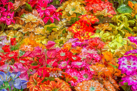 Background of artificial and very colorful flowers