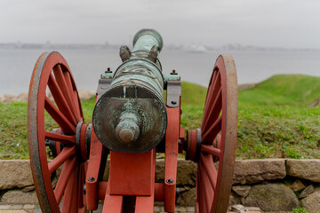 The old cannon is pointed towards the sea.