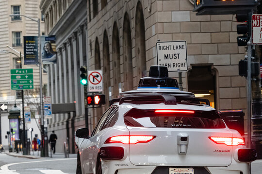 SAN FRANCISO, CALIFORNIA, USA – FEBRUARY 3, 2024: Waymo Self driving taxi car in Downtown San Francisco