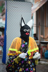 Fototapeta na wymiar People dressed in Venice carnival style are seen during the carnival in the city of Maragogipe, in Bahia.