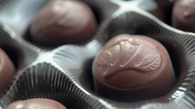 Macro Chocolate Candies In Packaging, Slider Shot
