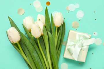 White tulips with gift box and confetti on turquoise background