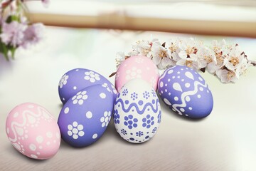 Easter concept, colored eggs with fresh flowers