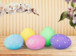 Easter concept, colored eggs with fresh flowers