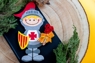 Sant Jordi of eva rubber with sword, shield and a small bouquet of red paper roses with a ribbon of...