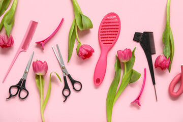 Hairdresser's tools with beautiful tulips on pink background