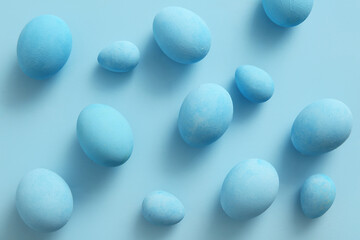 Painted Easter eggs on blue background