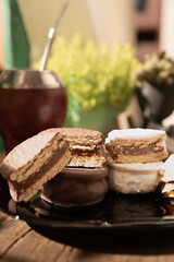 Argentine Alfajor with chocolate and meringue filled with dulce de leche