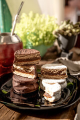 Argentine Alfajor with chocolate and meringue filled with dulce de leche