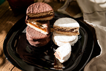 Argentine Alfajor with chocolate and meringue filled with dulce de leche