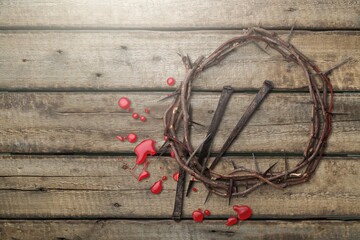 Christian crown of thorns of Jesus Christ with metal a nail on the Holy Cross