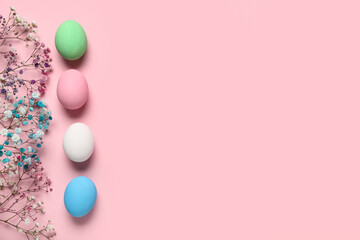 Composition with painted Easter eggs and beautiful gypsophila flowers on pink background