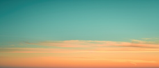 Obraz premium Pastel Colored Sunset Sky with Soft Clouds