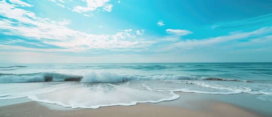 Tranquil Beach with Waves and Blue Sky