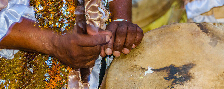 Candombe drummer playing at calls parade, montevideo, carnival