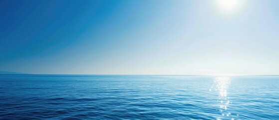 Fototapeta na wymiar Tranquil Blue Seascape with Shimmering Sunlight