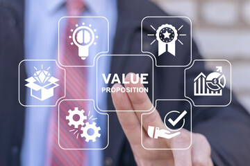 Businessman using virtual interface sees inscription: VALUE PROPOSITION. Concept of value...