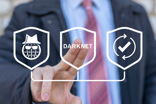 Businessman using virtual touchscreen presses word: DARKNET. Darknet and cybersecurity concept. Darknet browser deep dark web net internet technology.