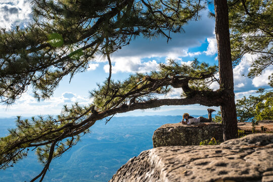 Phu Kradueng the scenery view of sunset in the evening at Lom Sak Cliff, the famous spot for tourists attraction.