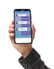 Man texting with friend using messaging application on smartphone against white background, closeup