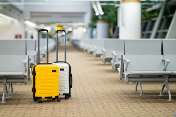 Travel, Two suitcases in an empty airport hall, traveler cases in the departure airport terminal waiting for the area, vacation concept, blank space for text message or design