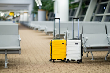 Travel, Two suitcases in an empty airport hall, traveler cases in the departure airport terminal waiting for the area, vacation concept, blank space for text message or design