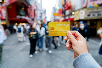 Travel card, Tourist woman showing credit card or travel card for convenient travel Make shopping...