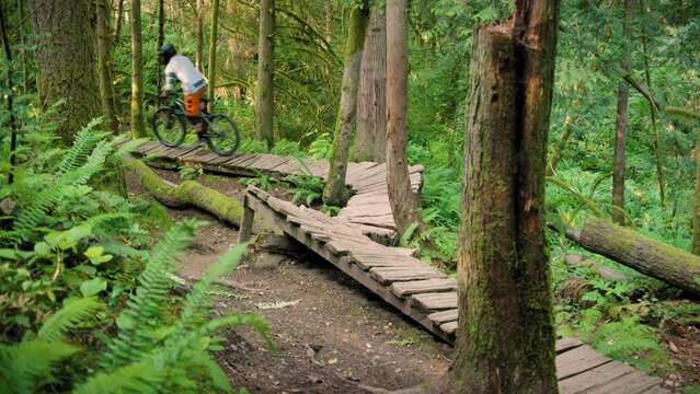 Mountain Bike Rider on Winding Wood Obstacle