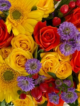 Colorful bouquet of flowers with red and yellow roses