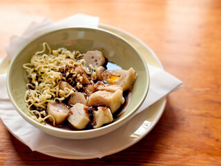 Pempek, Empek-Empek, traditional Asian food from South Sumatra, Indonesia. This fish-based food is very popular. Served with cuko sauce and cucumber slices