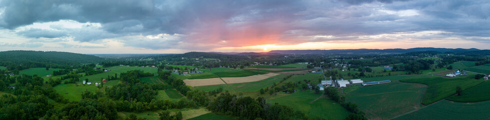 Fototapeta na wymiar Sunset and Clouds over Farmland