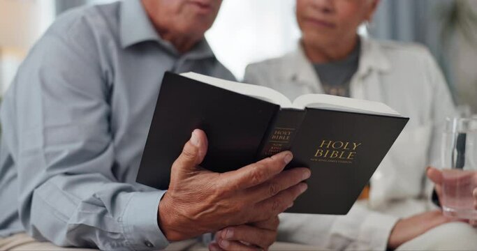 Couple, hands and home for reading bible, talking of faith and God with helping, support and scripture on sofa. Mature people or pastor in living room with holy book for religion and Christianity