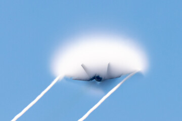 Very unusual close tail view of a F-35C Lightning II  at very high speed, in a  condensation cone (“singularity”) 