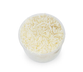 rice in the measuring cup isolated on white background.