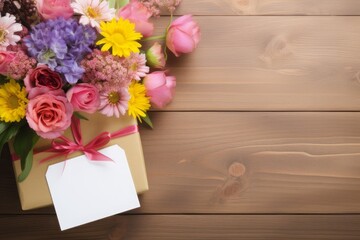 Bunch of flowers and tag with text on wooden background. Happy Birthday