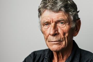 Obraz premium Portrait of a senior man with grey hair. Studio shot.