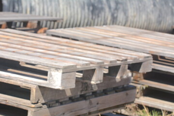 Abandoned pallets stacked together at the construction site