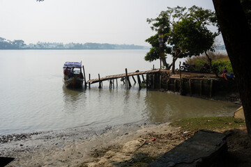 People get on and off the boat through the boat wharf. People can easily move from one side of the river to the other side.