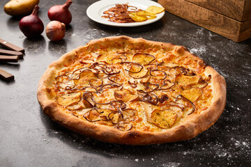 Fire pie Pizza with onion and crackers isolated on dark background with raw food top view of italian fastfood appetizer